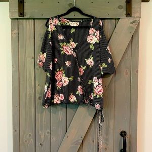 Emerald brand floral & pin stripe cold shoulder blouse with elastic bottom hem.